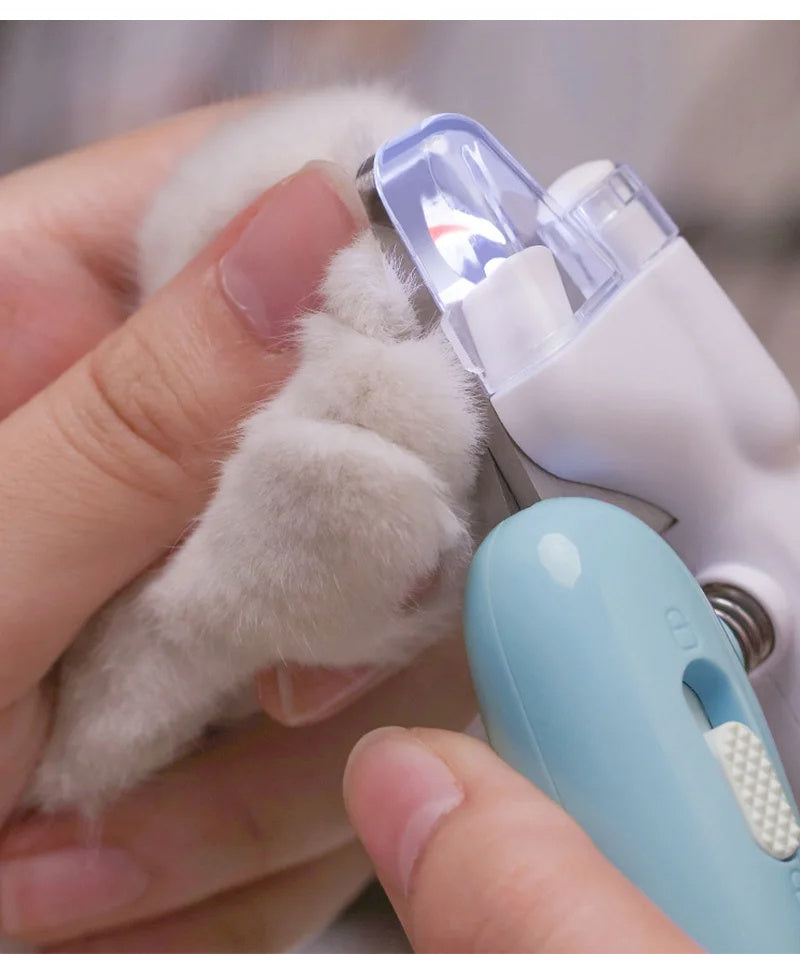 A display image of the snugglebugsupply's Pet Nail Clippers being used for pet