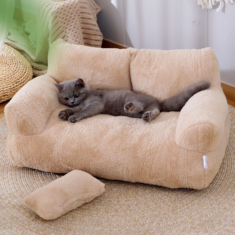 A display image of a pet sitting on the Snugglebugsupply's Luxury Winter Sofa Cat Bed