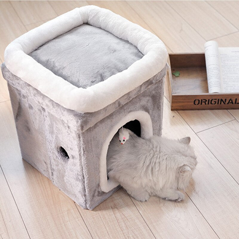 A display image of a pet  sitting inside the Snugglebugsupply's Pet House Bed