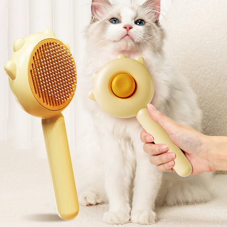 A display image of a hand using the Snugglebugsupply's Pets Grooming Massage Combs for a pet